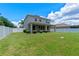 Spacious backyard featuring lush green grass and a secure white fence at 2560 Hayden Valley Street, Apopka, FL 32703