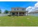 Beautiful two-story home featuring a large fenced backyard and a covered patio at 2560 Hayden Valley Street, Apopka, FL 32703