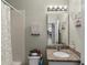 Bathroom featuring shower, toilet and vanity with granite countertop at 2560 Hayden Valley Street, Apopka, FL 32703