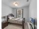 Bedroom with neutral walls, comfortable bed, side table, and TV at 2560 Hayden Valley Street, Apopka, FL 32703