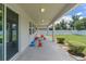 Covered patio featuring tile flooring, recessed lighting, and easy access to outdoor activities in the fenced yard at 2560 Hayden Valley Street, Apopka, FL 32703