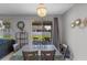 Cozy dining area with backyard view and stylish chandelier at 2560 Hayden Valley Street, Apopka, FL 32703