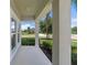 Inviting front porch with view of landscaped yard and neighborhood street at 2560 Hayden Valley Street, Apopka, FL 32703