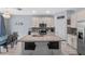Spacious kitchen with granite countertops, a large island, and stainless steel appliances at 2560 Hayden Valley Street, Apopka, FL 32703