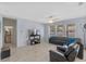 Open-concept living room with tile flooring and multiple windows, providing natural light at 2560 Hayden Valley Street, Apopka, FL 32703