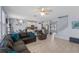 Spacious living area showcases an open floor plan, tile floors, modern furniture and lots of natural light at 2560 Hayden Valley Street, Apopka, FL 32703