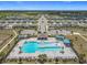 Aerial view of the community's recreational facilities including a pool, playground, and amenity center at 313 Sofia Ln, Lake Alfred, FL 33850