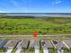 This aerial view showcases a single-Gathering home with a lovely scenic greenbelt view at 313 Sofia Ln, Lake Alfred, FL 33850