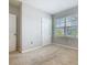 Cozy bedroom with natural light, a single window, plush carpet, and neutral walls at 313 Sofia Ln, Lake Alfred, FL 33850
