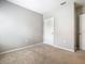 Bedroom with neutral walls, carpet and doors at 313 Sofia Ln, Lake Alfred, FL 33850