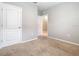 Neutral bedroom featuring a clean and simple design with carpet and two doors at 313 Sofia Ln, Lake Alfred, FL 33850