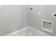 Bright laundry room featuring tile floors and hookups for a washer and dryer at 313 Sofia Ln, Lake Alfred, FL 33850