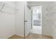 Walk-in closet leads to the bright bathroom with double vanity and walk-in shower at 313 Sofia Ln, Lake Alfred, FL 33850