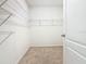 Walk-in closet with carpet floor and wire shelving for optimal storage at 313 Sofia Ln, Lake Alfred, FL 33850