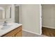Bathroom with a vanity and walk in closet with wire shelving at 3322 Park Branch Ave, Clermont, FL 34711