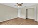 Bright bedroom features wood-look floors, a closet and neutral paint at 3322 Park Branch Ave, Clermont, FL 34711