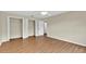 Bedroom with wood flooring, and two reach-in closets at 3322 Park Branch Ave, Clermont, FL 34711