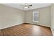A serene bedroom featuring wood-look floors, neutral walls and a ceiling fan at 3322 Park Branch Ave, Clermont, FL 34711