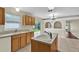 An open kitchen with an island and sliding glass doors to the backyard at 3322 Park Branch Ave, Clermont, FL 34711