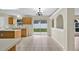 An open kitchen with an island and sliding glass doors to the backyard at 3322 Park Branch Ave, Clermont, FL 34711