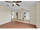 Spacious living room with ceiling fan, neutral paint, tile floors, and an open floor plan at 3322 Park Branch Ave, Clermont, FL 34711