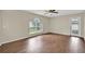Spacious living room featuring wood-look floors, natural light and neutral walls at 3322 Park Branch Ave, Clermont, FL 34711