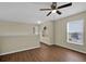 Loft area with wood-look floors, natural light, and neutral walls at 3322 Park Branch Ave, Clermont, FL 34711