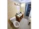Bathroom featuring wallpaper and toilet at 333 Lake Howard Nw Dr # 201A, Winter Haven, FL 33880