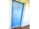 Blue front door marked 201A with a peephole and two locks at 333 Lake Howard Nw Dr # 201A, Winter Haven, FL 33880