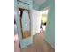 Hallway with convenient built-in ironing board, perfect for optimizing space at 333 Lake Howard Nw Dr # 201A, Winter Haven, FL 33880
