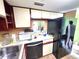 Features of the kitchen include a microwave, dishwasher, refrigerator, and ample cabinet space at 333 Lake Howard Nw Dr # 201A, Winter Haven, FL 33880