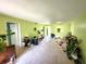 A second view of the expansive, brightly-colored living room; needs some work at 333 Lake Howard Nw Dr # 201A, Winter Haven, FL 33880