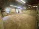 Large, unfinished basement space with concrete floor, block walls, and utility lighting at 3695 Dale Ct, Mount Dora, FL 32757
