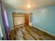 Cozy bedroom with plank flooring and a closet; ample natural light filters through the two windows at 3695 Dale Ct, Mount Dora, FL 32757