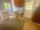 Laundry room with washer, dryer, utility sink, and a door leading to the outside at 3695 Dale Ct, Mount Dora, FL 32757