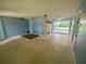 Bright living room with view to kitchen and sun room provides ample space to relax at 3695 Dale Ct, Mount Dora, FL 32757
