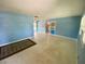 Spacious living room with a large rug, vintage flooring and natural light is move-in ready at 3695 Dale Ct, Mount Dora, FL 32757