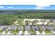 An aerial view showcasing the community with well-maintained homes and natural surroundings at 3964 Mayhill Loop, Eustis, FL 32736