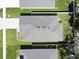 Aerial view showcases detailed roof, manicured lawn, and proximity to neighboring homes at 3964 Mayhill Loop, Eustis, FL 32736