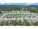 New single-Gathering homes line the streets of the community with green spaces and manicured lawns at 3964 Mayhill Loop, Eustis, FL 32736