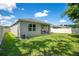 Expansive backyard with a covered patio, perfect for outdoor entertainment at 3964 Mayhill Loop, Eustis, FL 32736