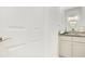 Bright bathroom vanity with double sinks, granite counters, and ample storage space at 3964 Mayhill Loop, Eustis, FL 32736
