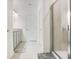 Modern bathroom with glass shower, double sinks, and tile flooring at 3964 Mayhill Loop, Eustis, FL 32736