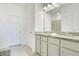 Bathroom featuring double sinks, granite counters, and ample cabinet space at 3964 Mayhill Loop, Eustis, FL 32736