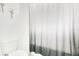 Bathroom featuring a toilet and a simple shower curtain at 3964 Mayhill Loop, Eustis, FL 32736