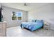 Relaxing bedroom with a large window for natural light and wood-look floors at 3964 Mayhill Loop, Eustis, FL 32736