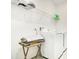 A convenient laundry room featuring modern white appliances and wire shelving at 3964 Mayhill Loop, Eustis, FL 32736