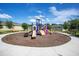 A colorful community playground with slides and climbing structures for to enjoy at 3964 Mayhill Loop, Eustis, FL 32736