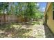 Spacious backyard with partial grass and a wood privacy fence providing privacy at 419 Cierra Oaks Cir, Lady Lake, FL 32159
