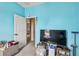 Bedroom features a TV and a doorway that leads to another room at 419 Cierra Oaks Cir, Lady Lake, FL 32159
